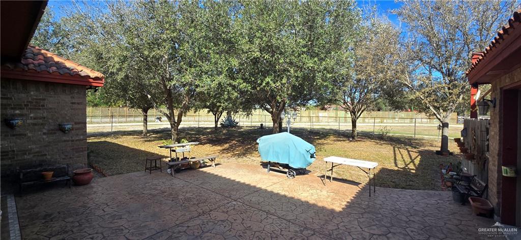 5312 Mile 4 Road Mission, TX 78573 - Photo 13 of 13 Fenced backyard featuring a patio area