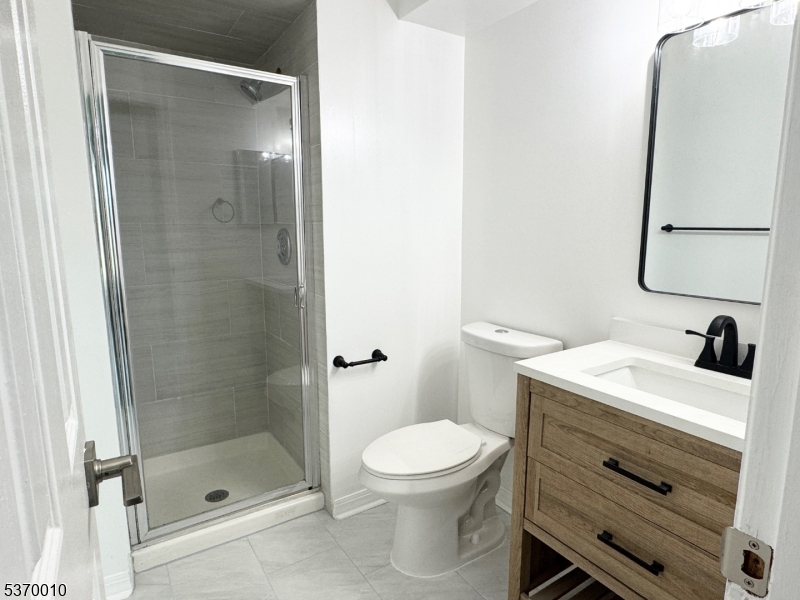 76 Jamestown Road Bernards, NJ 07920 - Photo 5 of 20 a bathroom with a sink a toilet and shower