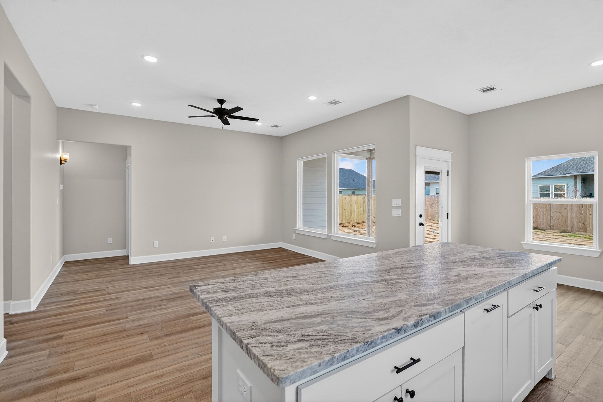 200 Orchard Cove Snook, TX 77879 - Photo 11 of 45 a view of an empty room and window and wooden floor
