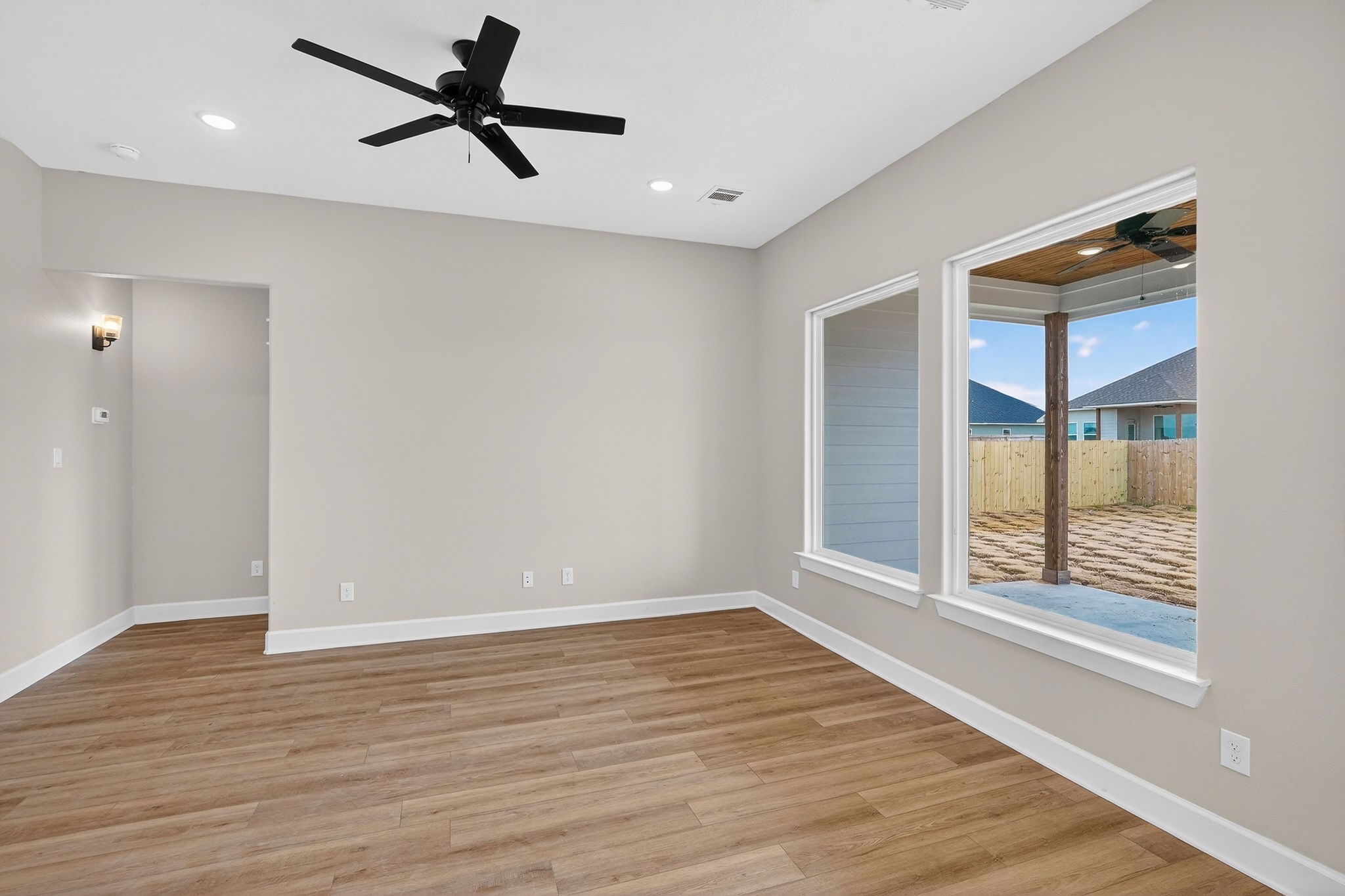 200 Orchard Cove Snook, TX 77879 - Photo 13 of 45 wooden floor in an empty room with a window