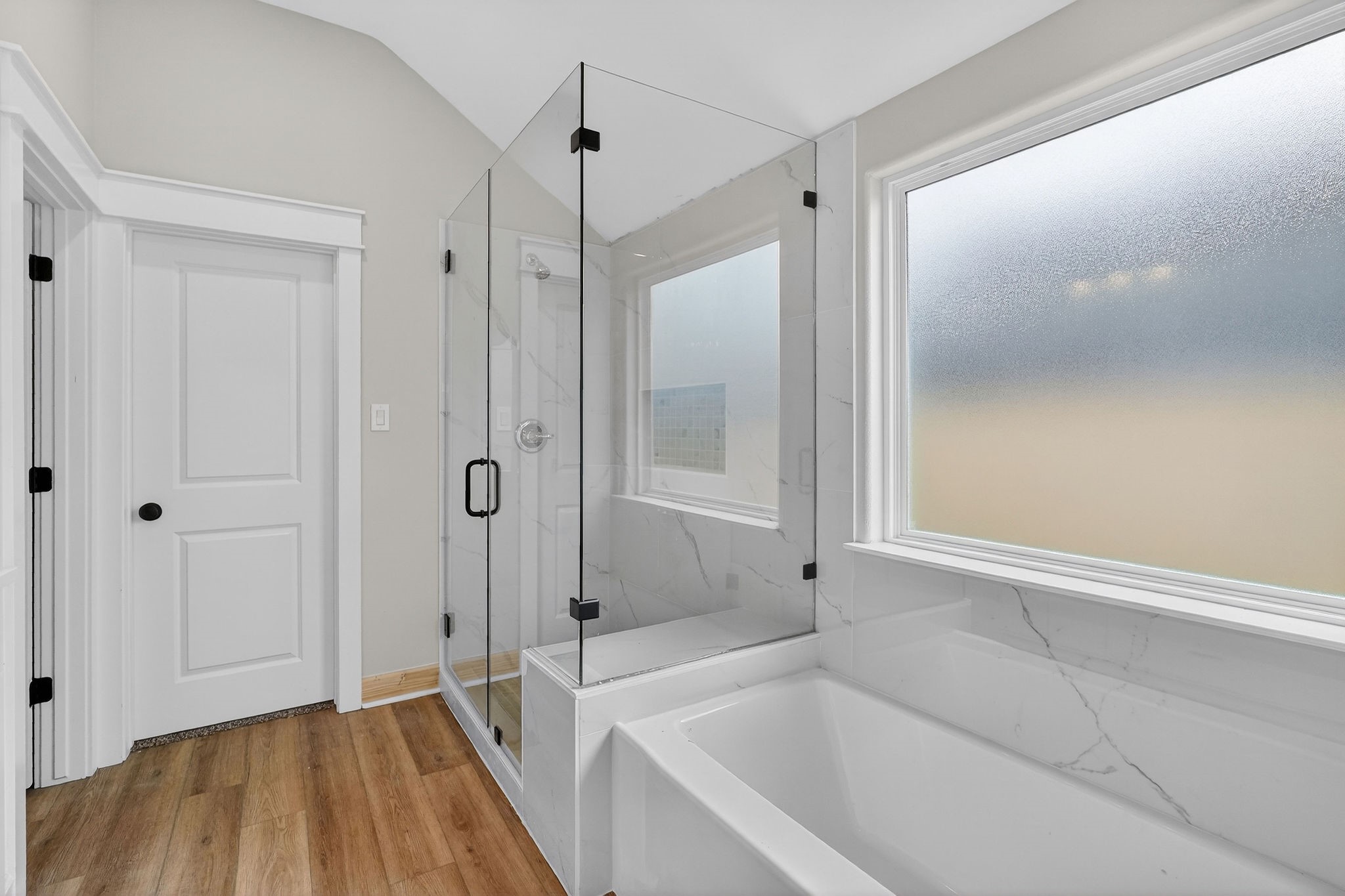 200 Orchard Cove Snook, TX 77879 - Photo 16 of 45 a bathroom with a bathtub and a shower