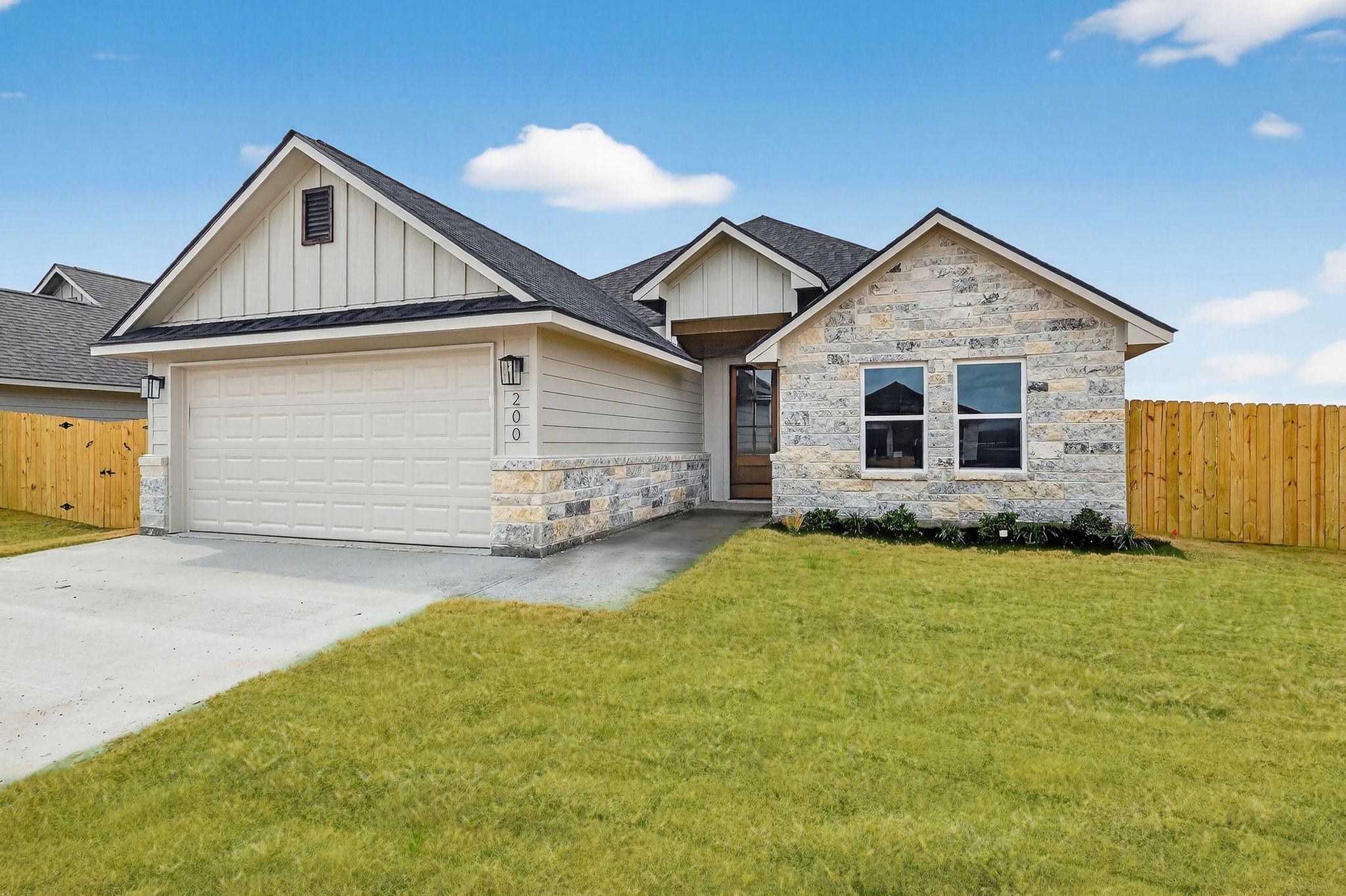 200 Orchard Cove Snook, TX 77879 - Photo 2 of 45 a front view of a house with yard