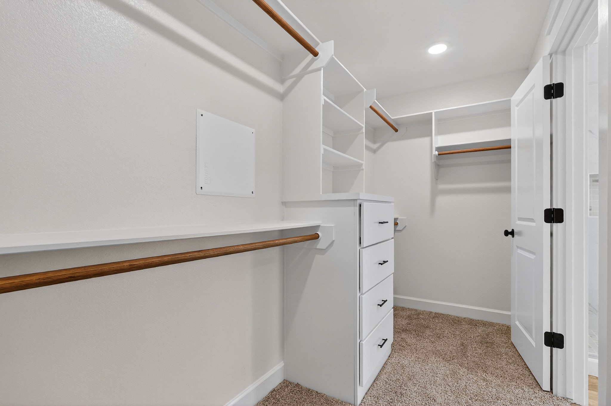 200 Orchard Cove Snook, TX 77879 - Photo 21 of 45 a view of walk in closet with empty racks