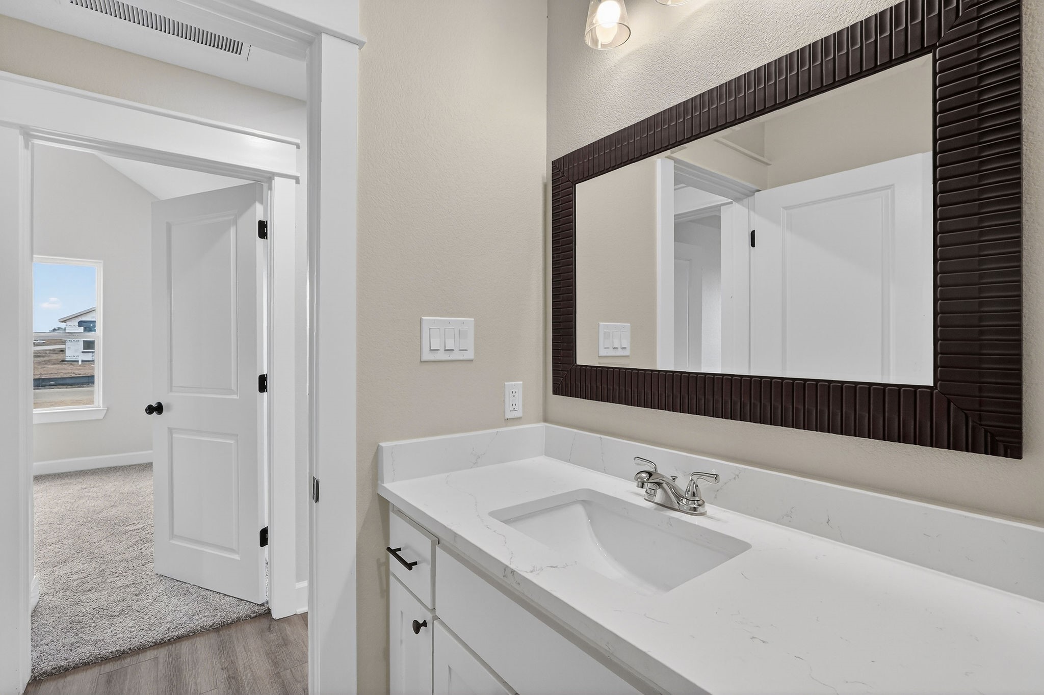 200 Orchard Cove Snook, TX 77879 - Photo 24 of 45 a bathroom with a sink and a mirror