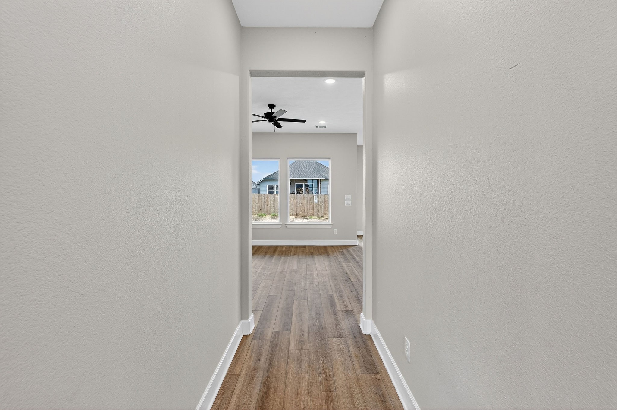 200 Orchard Cove Snook, TX 77879 - Photo 4 of 45 a view of a hallway with wooden floor and a bathroom