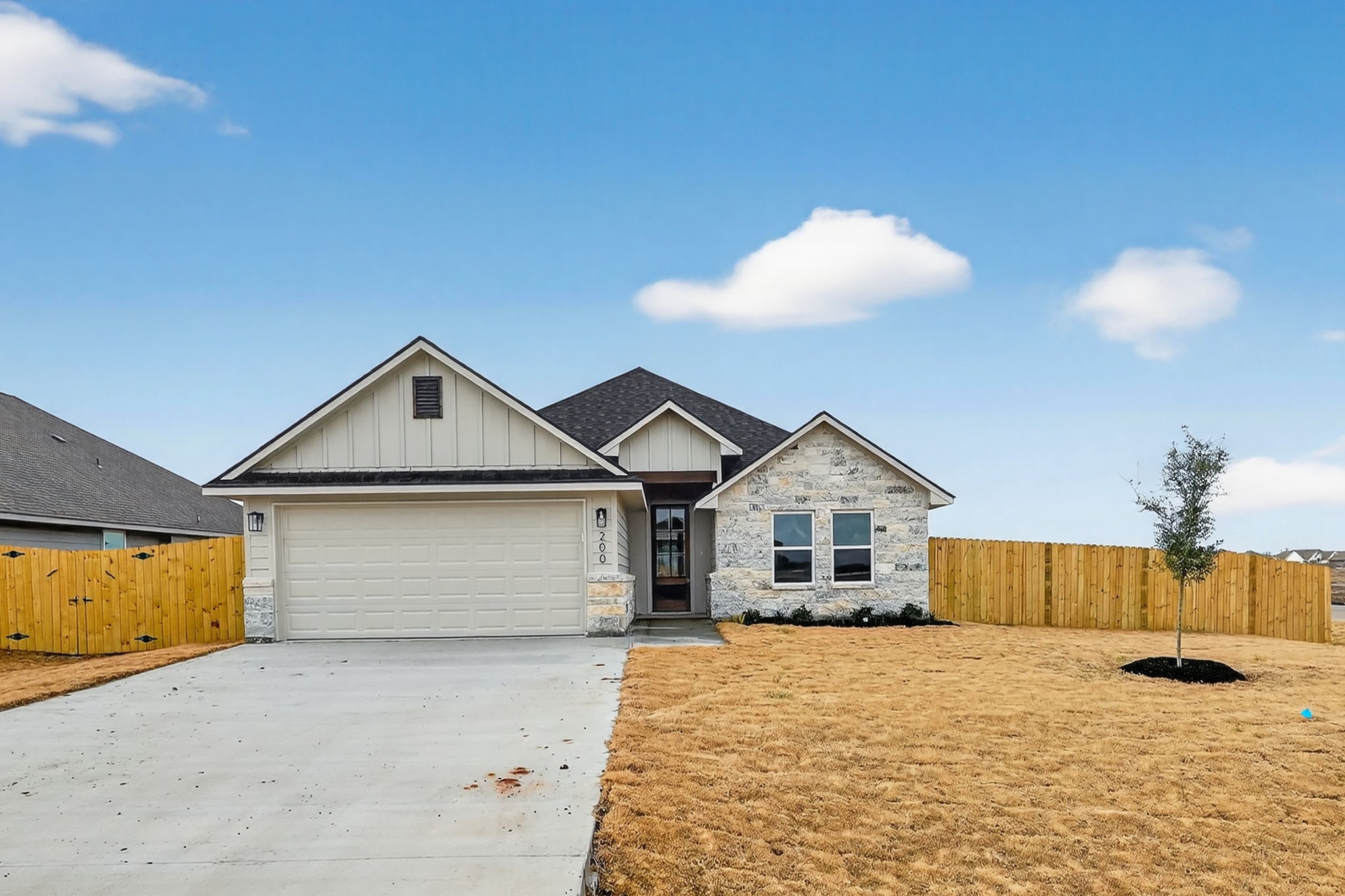 200 Orchard Cove Snook, TX 77879 - Photo 41 of 45 a view of a house with a yard and garage