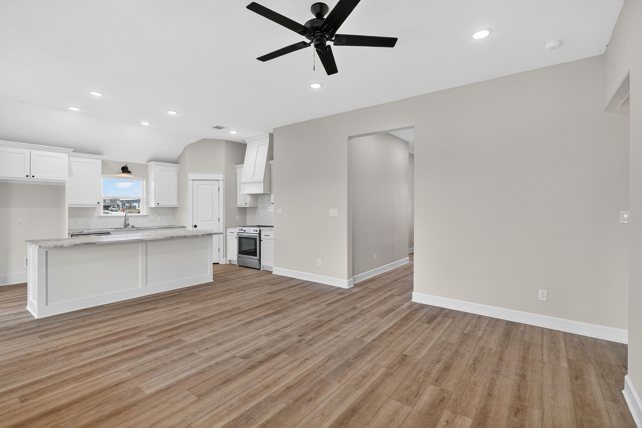 200 Orchard Cove Snook, TX 77879 - Photo 6 of 45 a view of kitchen with wooden floor and window
