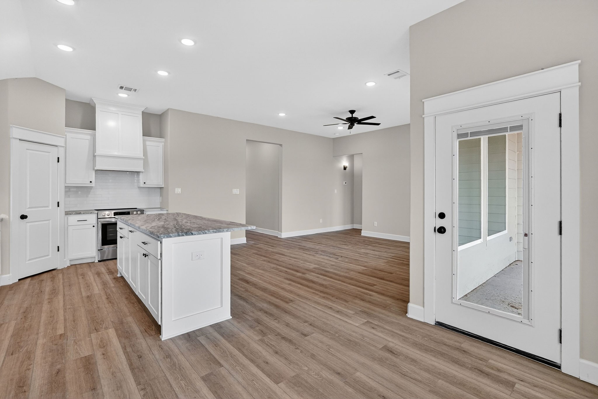 200 Orchard Cove Snook, TX 77879 - Photo 7 of 45 a large kitchen with a lot of counter space and wooden floor
