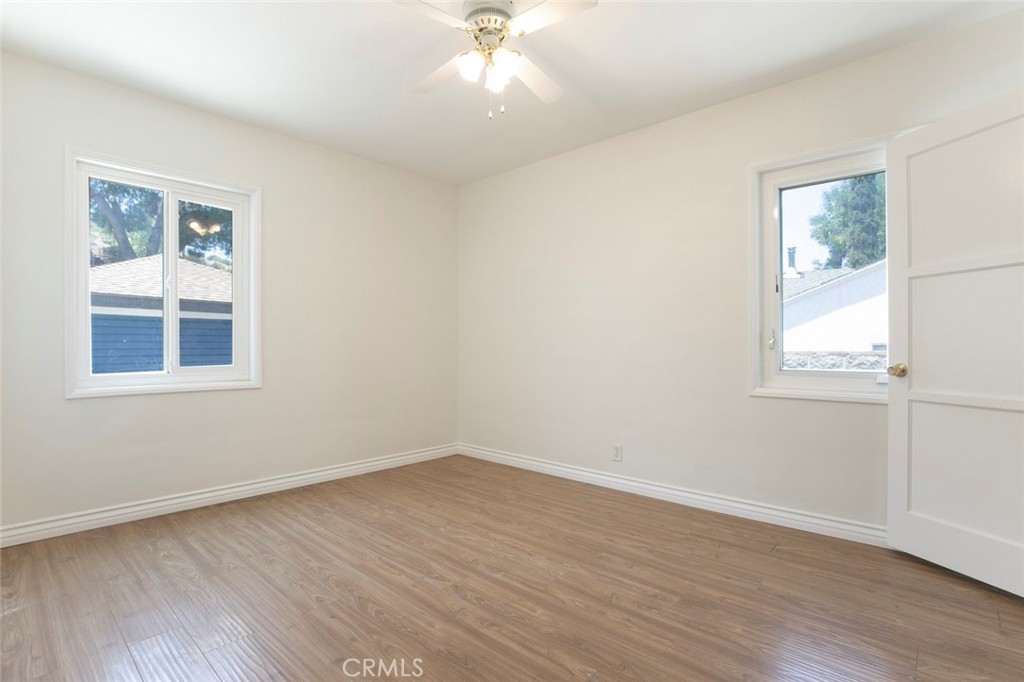 10347 Newhome Avenue Sunland, CA 91040 - Photo 18 of 33 a view of empty room with wooden floor and fan