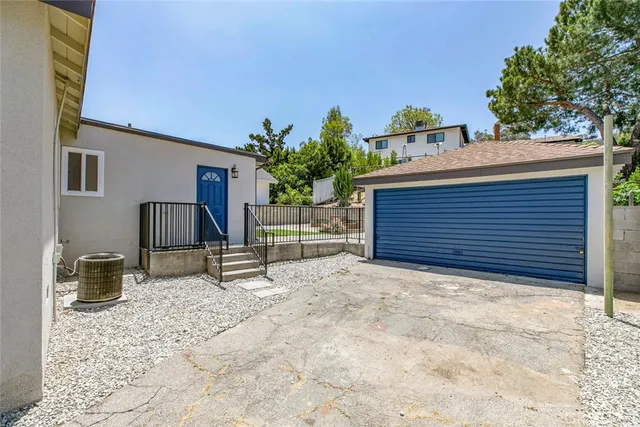 a backyard of a house with seating space