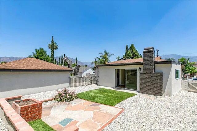 a view of a backyard with sitting area