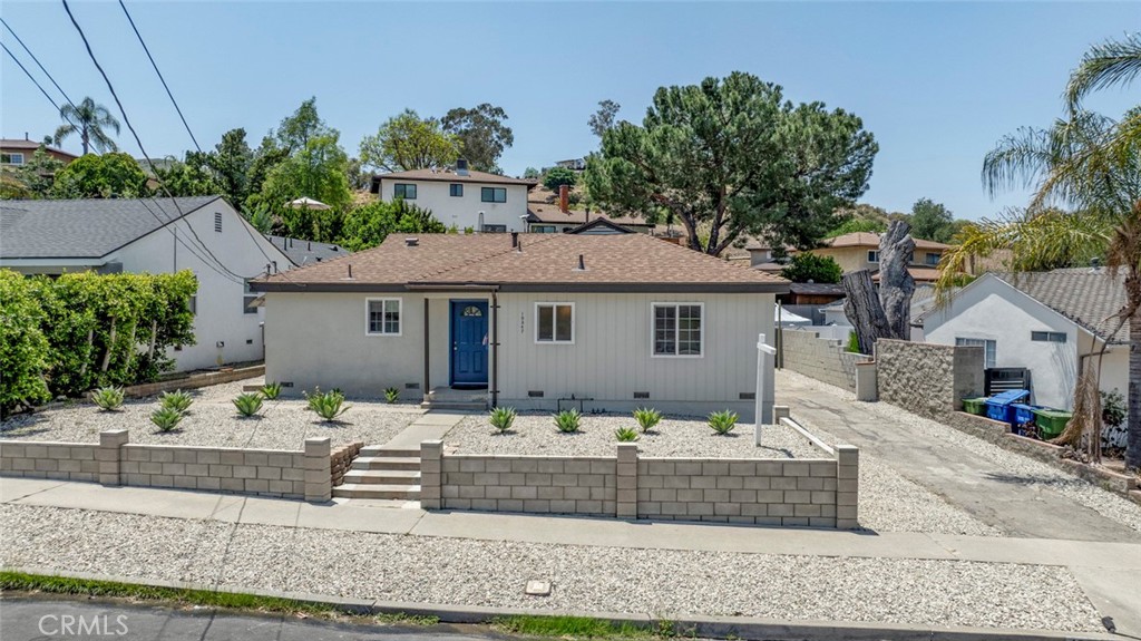 10347 Newhome Avenue Sunland, CA 91040 - Photo 3 of 33 a front view of a house with lots of green space