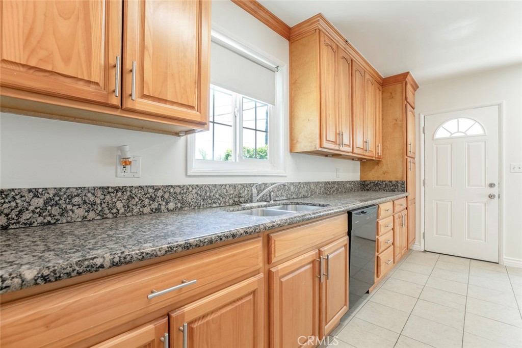 10347 Newhome Avenue Sunland, CA 91040 - Photo 8 of 33 a kitchen with granite countertop a sink and cabinets