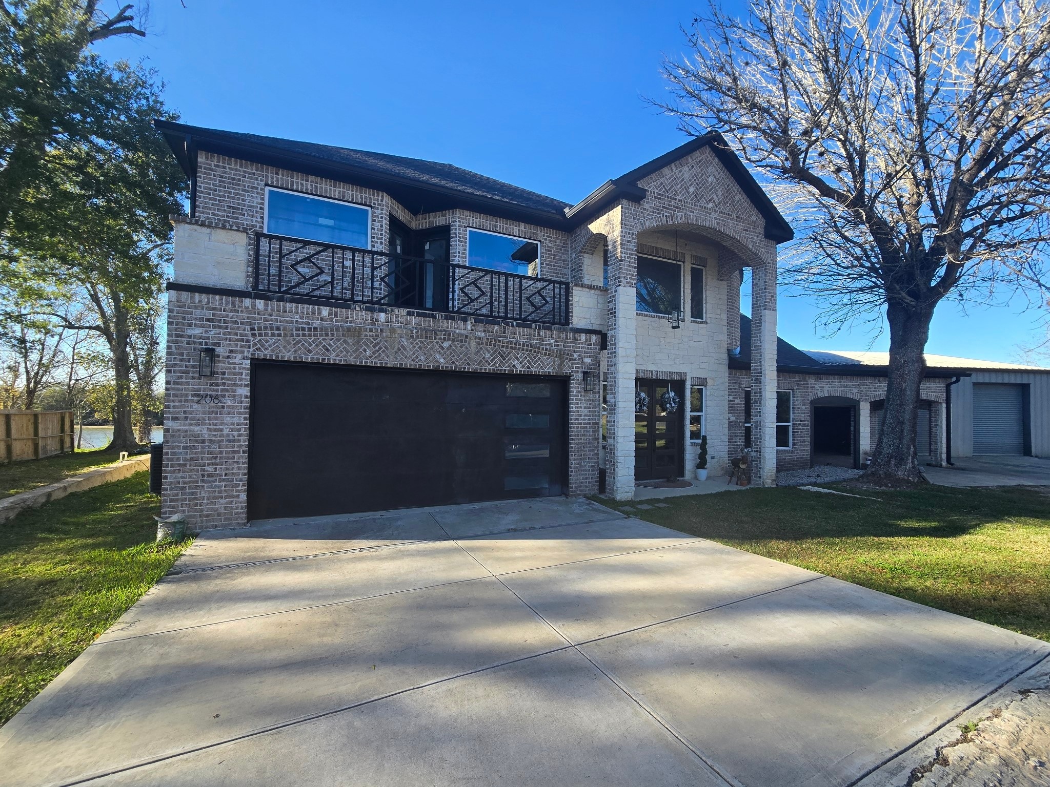 206 Elm Street Highlands, TX 77562 - Photo 3 of 9 a front view of a house with a yard