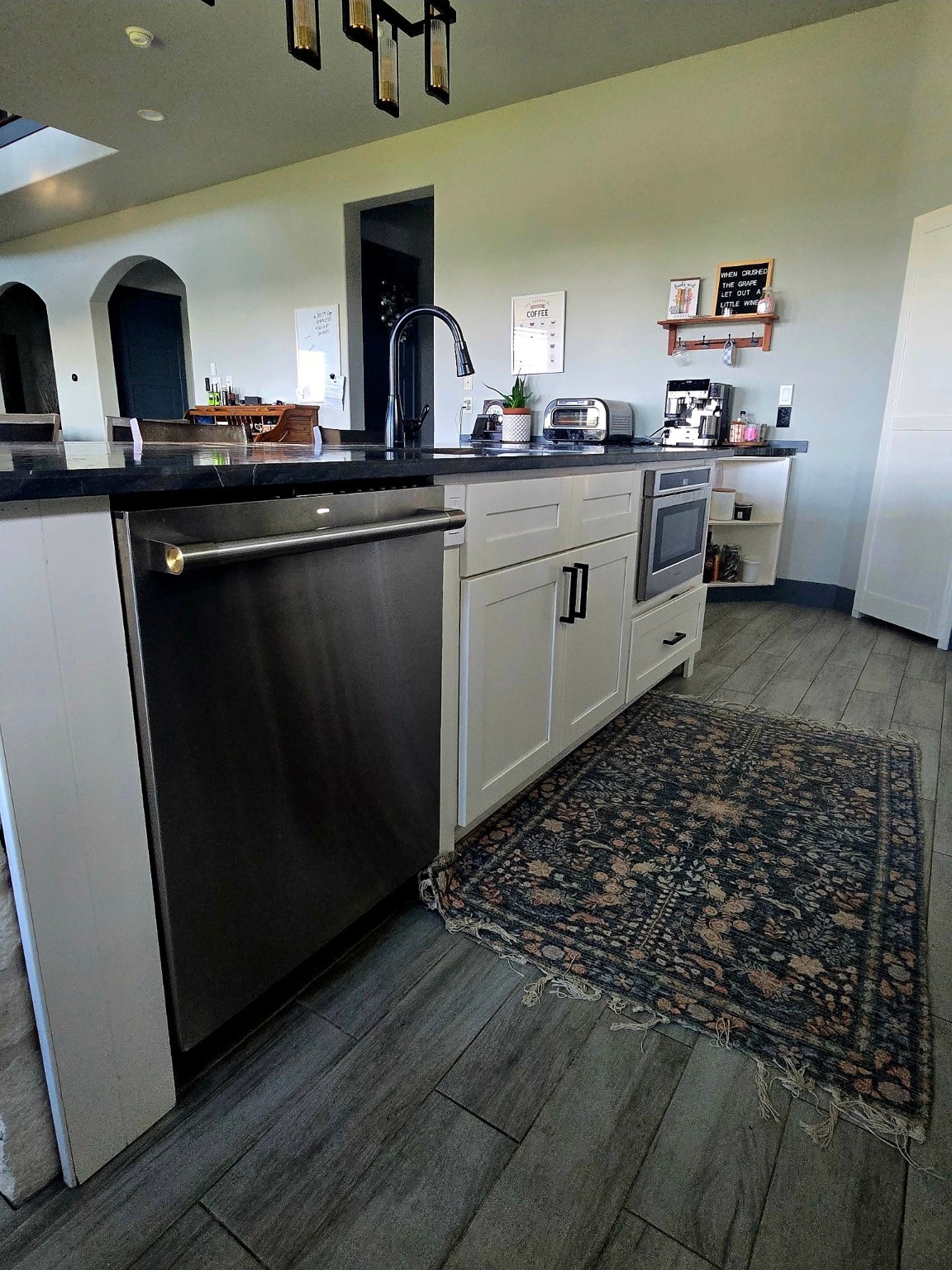 206 Elm Street Highlands, TX 77562 - Photo 7 of 9 a kitchen with granite countertop a sink and cabinets