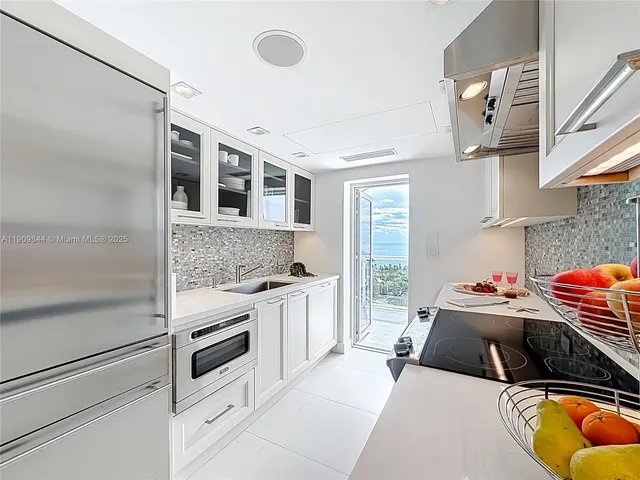 a kitchen with stainless steel appliances granite countertop a stove and a sink