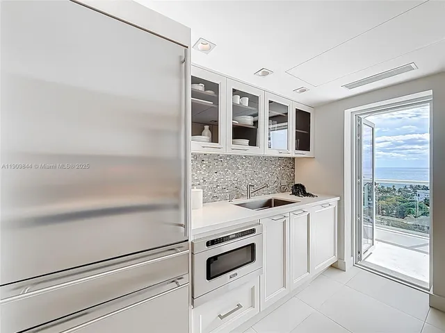 a kitchen with a stove and a refrigerator