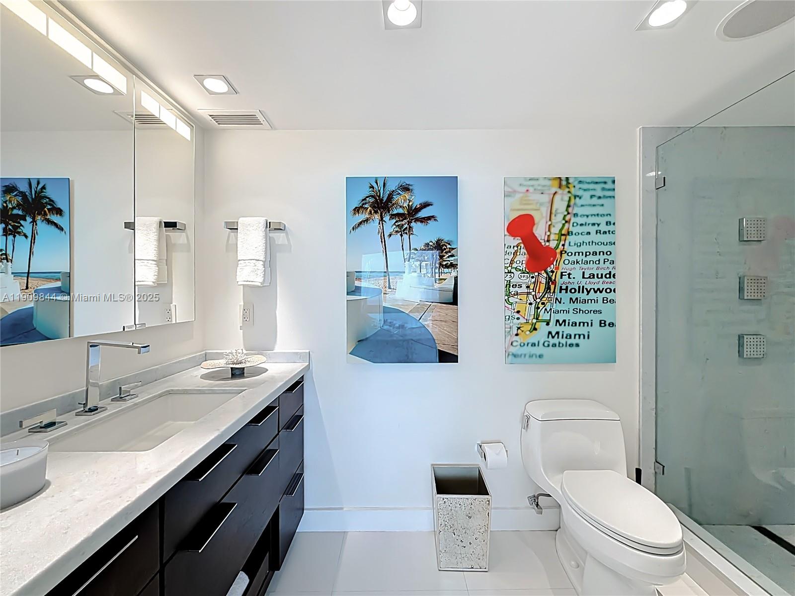 2715 North Ocean Boulevard, Unit 15D Fort Lauderdale, FL 33308 - Photo 27 of 57 a bathroom with a sink a toilet and shower