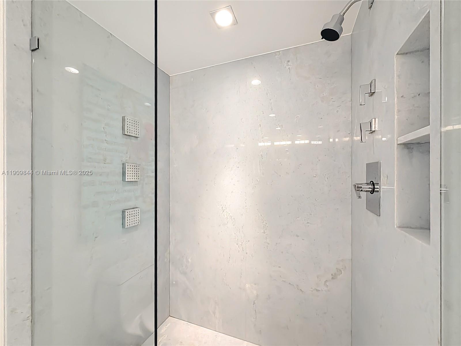 2715 North Ocean Boulevard, Unit 15D Fort Lauderdale, FL 33308 - Photo 29 of 57 a bathroom with a shower and a glass door