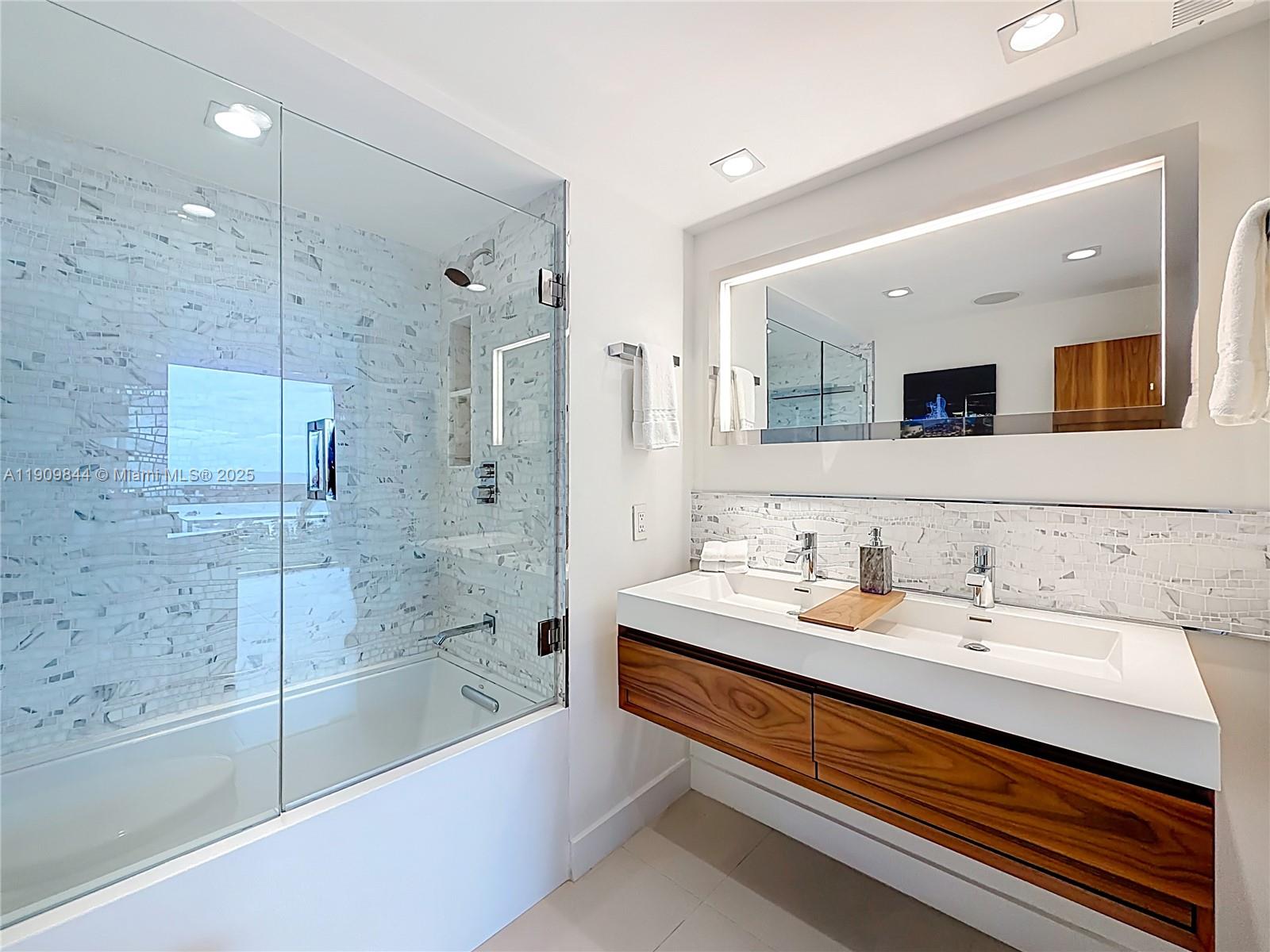 2715 North Ocean Boulevard, Unit 15D Fort Lauderdale, FL 33308 - Photo 36 of 57 a bathroom with a bathtub and a sink