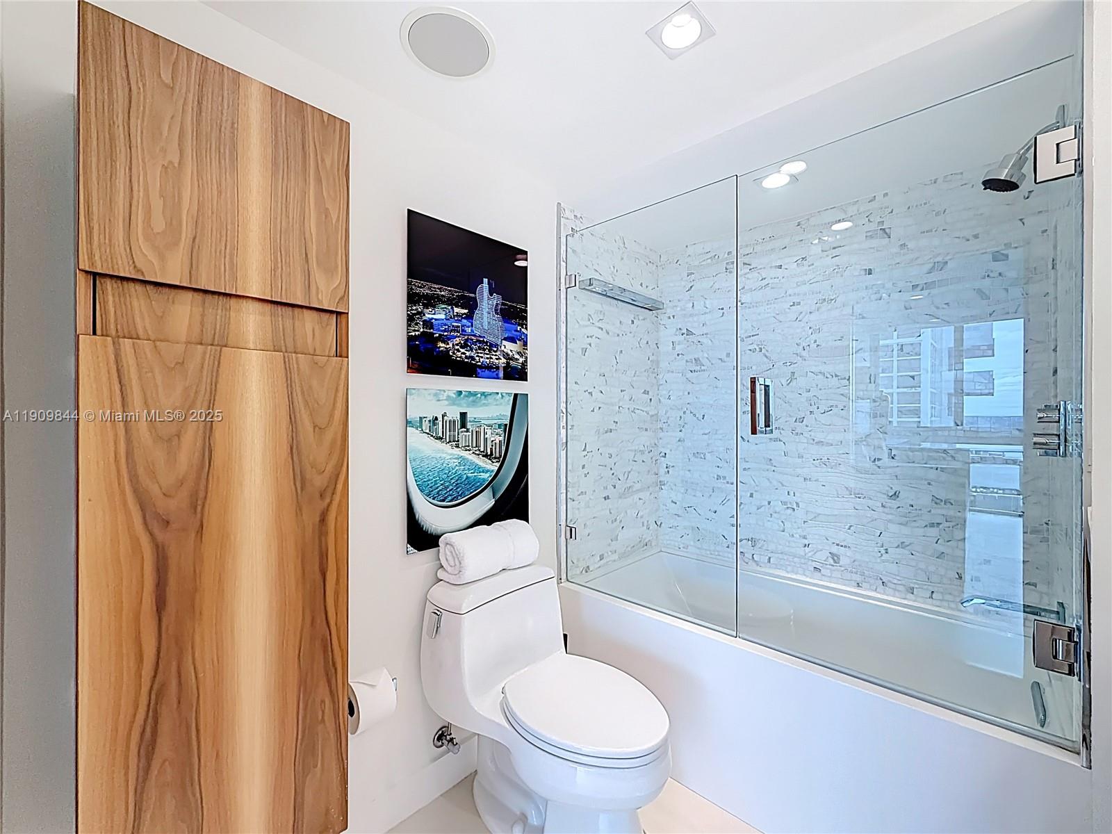 2715 North Ocean Boulevard, Unit 15D Fort Lauderdale, FL 33308 - Photo 37 of 57 a white toilet sitting next to a bathroom sink