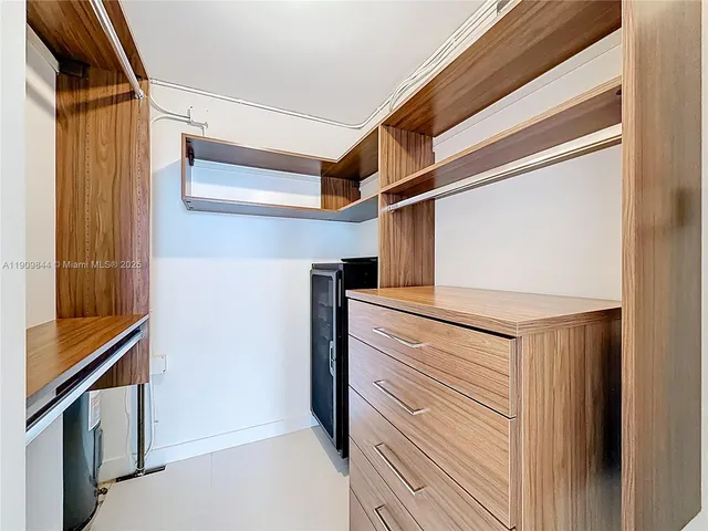 a balcony with a table and chairs and a stove