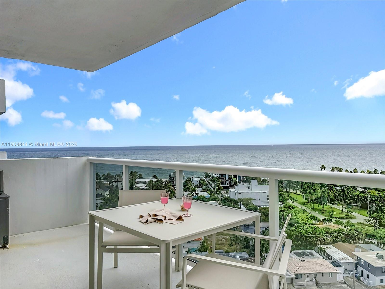 2715 North Ocean Boulevard, Unit 15D Fort Lauderdale, FL 33308 - Photo 41 of 57 a view of a table and chairs in a patio