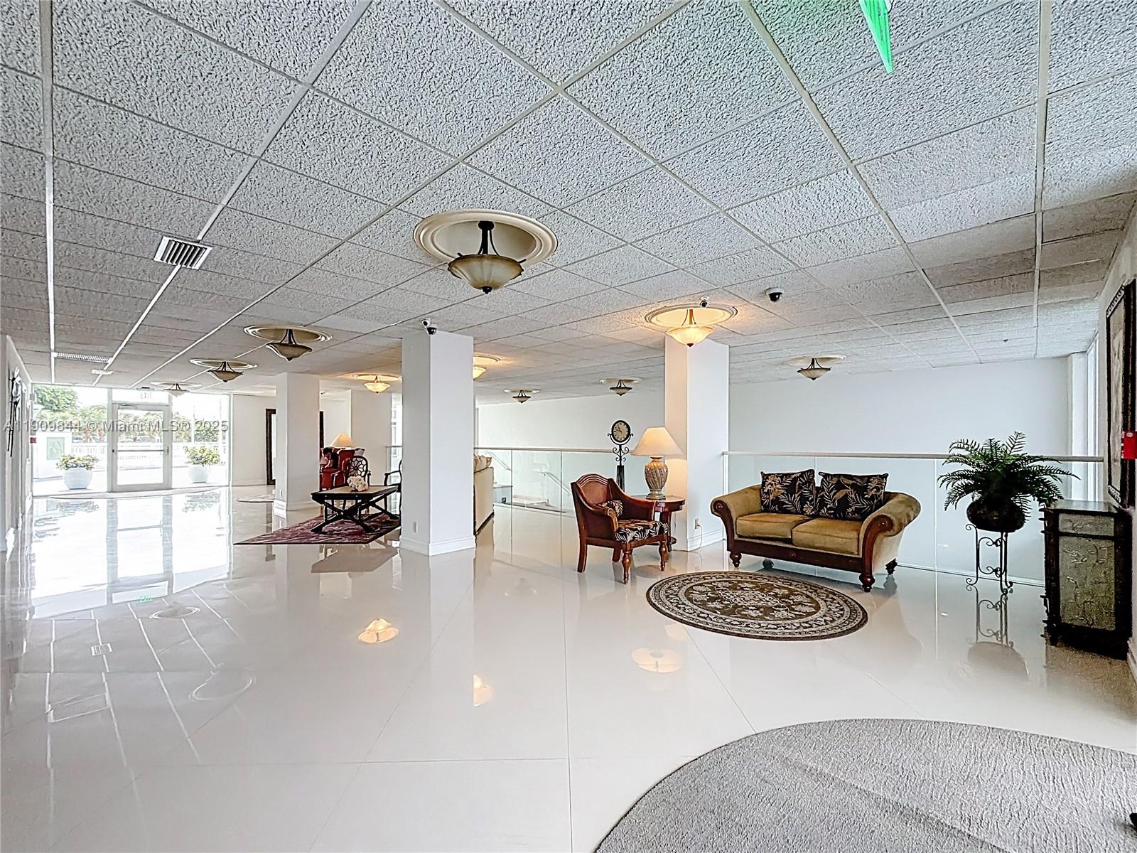 2715 North Ocean Boulevard, Unit 15D Fort Lauderdale, FL 33308 - Photo 47 of 57 a living room with furniture and a large window