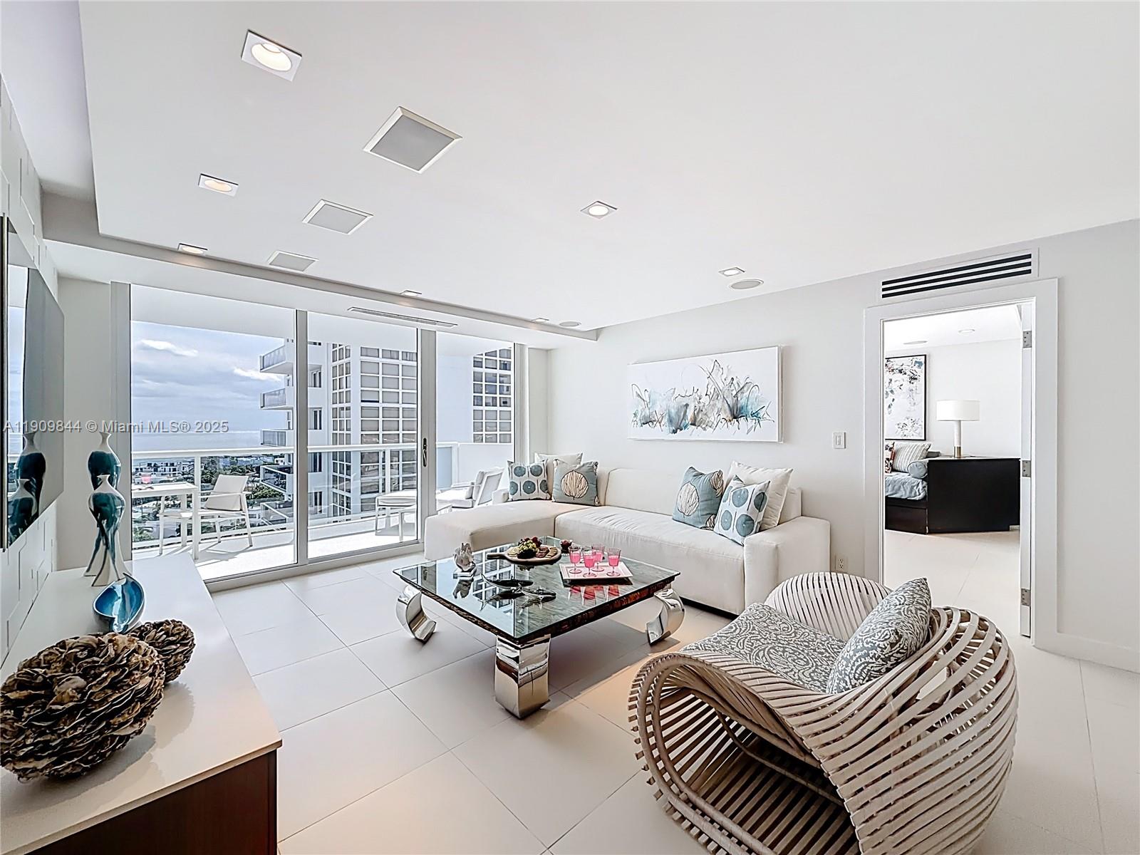 2715 North Ocean Boulevard, Unit 15D Fort Lauderdale, FL 33308 - Photo 6 of 57 a living room with furniture and a flat screen tv