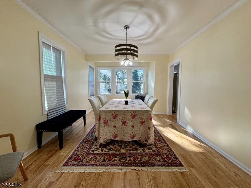 89 Hay Avenue Nutley, NJ 07110 - Photo 11 of 24 a living room with furniture and a chandelier
