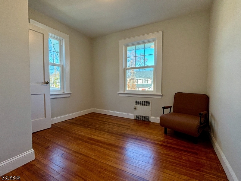 89 Hay Avenue Nutley, NJ 07110 - Photo 16 of 24 a room with a window and wooden floor
