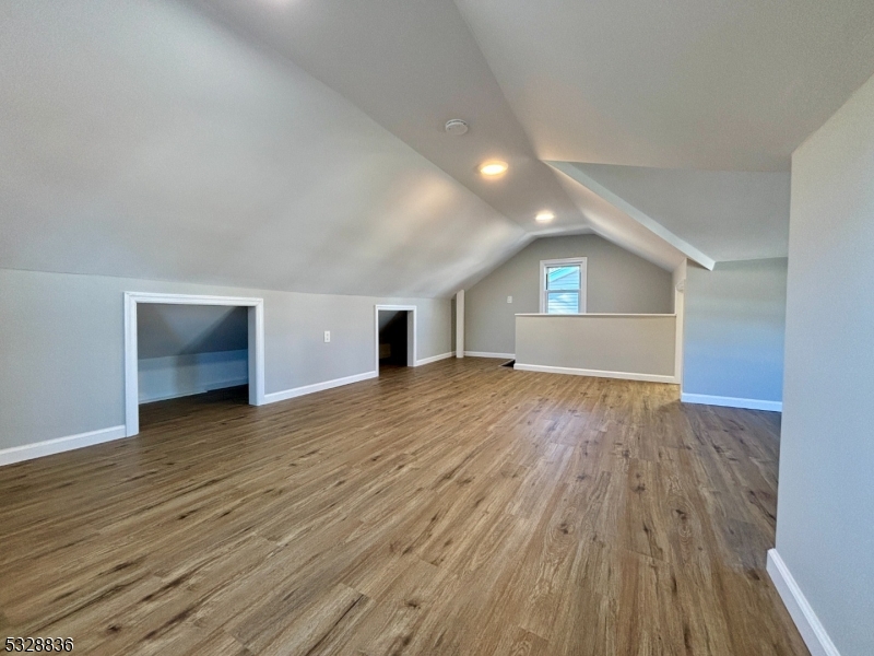 89 Hay Avenue Nutley, NJ 07110 - Photo 19 of 24 a view of empty room with wooden floor and fireplace