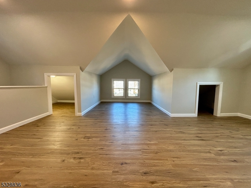 89 Hay Avenue Nutley, NJ 07110 - Photo 20 of 24 a view of empty room with wooden floor and window