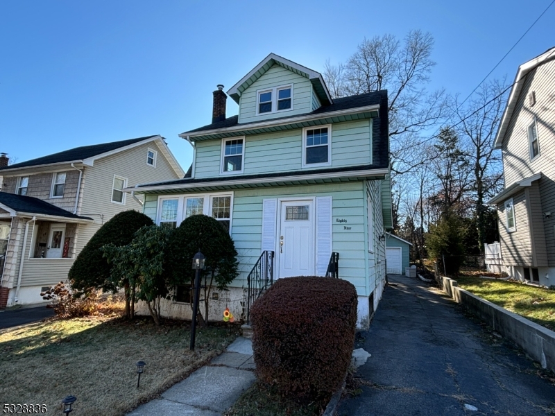 89 Hay Avenue Nutley, NJ 07110 - Photo 24 of 24 a front view of a house with garden