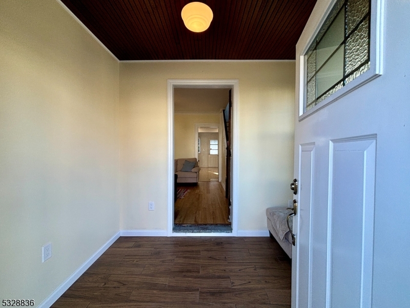 89 Hay Avenue Nutley, NJ 07110 - Photo 3 of 24 a view of a livingroom with wooden floor and a bathroom