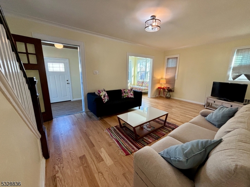 89 Hay Avenue Nutley, NJ 07110 - Photo 6 of 24 a living room with furniture and a flat screen tv