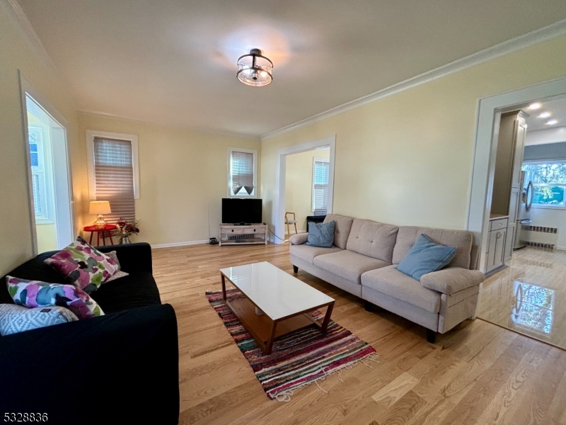 89 Hay Avenue Nutley, NJ 07110 - Photo 8 of 24 a living room with furniture a rug and a window