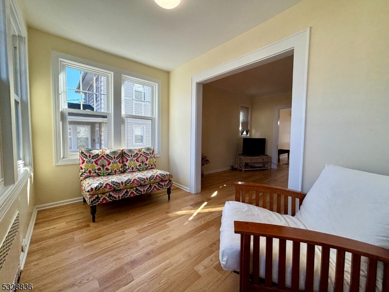 89 Hay Avenue Nutley, NJ 07110 - Photo 9 of 24 a bedroom with furniture and a wooden floor