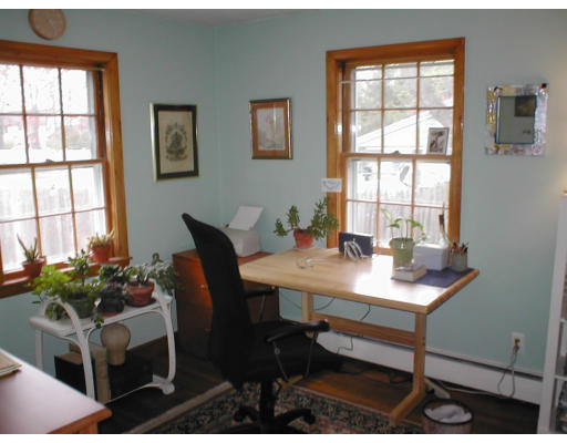 16 Eaton Road Framingham, MA 01701 - Photo 6 of 10 a view of a workspace with a table and chair in a room