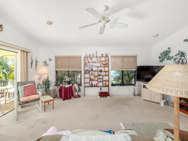 a bedroom with bed and a window