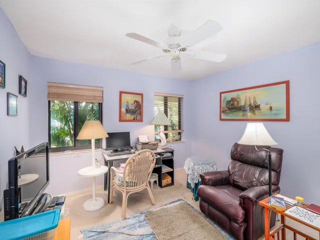 a bathroom with a sink a toilet a mirror and shower