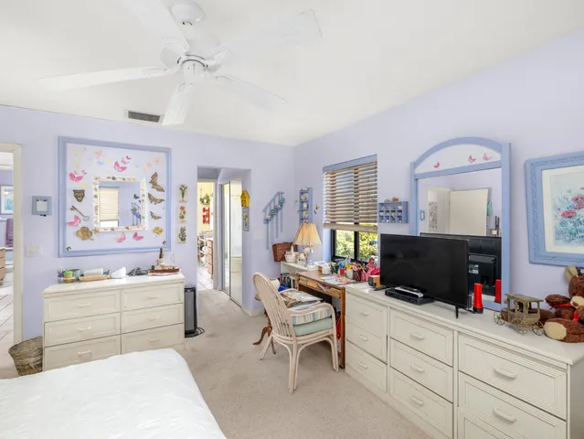 a view of house with swimming pool outdoor seating