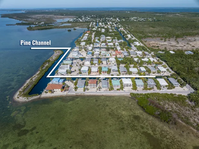 a view of a backyard with sitting area