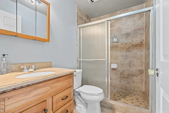 a front view of a house with yard and green space