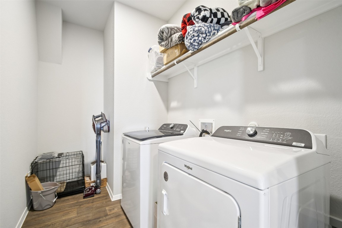 5525 Sacra Cove Austin, TX 78747 - Photo 12 of 20 a utility room with dryer and washer