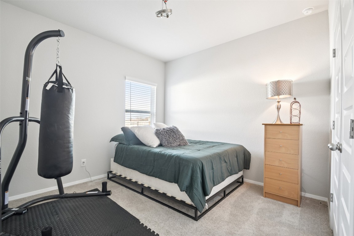 5525 Sacra Cove Austin, TX 78747 - Photo 13 of 20 a bedroom with a bed and a window