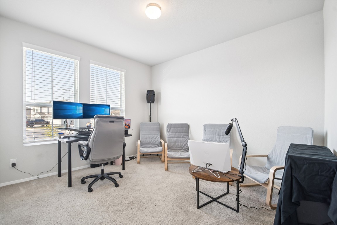 5525 Sacra Cove Austin, TX 78747 - Photo 16 of 20 a view of a workspace with furniture and a window