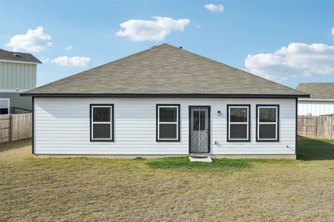 5525 Sacra Cove Austin, TX 78747 - Photo 18 of 20 a front view of a house with a garden