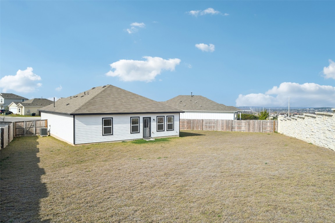 5525 Sacra Cove Austin, TX 78747 - Photo 19 of 20 a view of a house with a yard and lake view