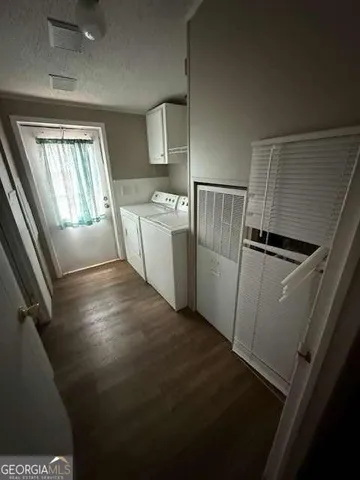 a view of a storage & utility room with a sink